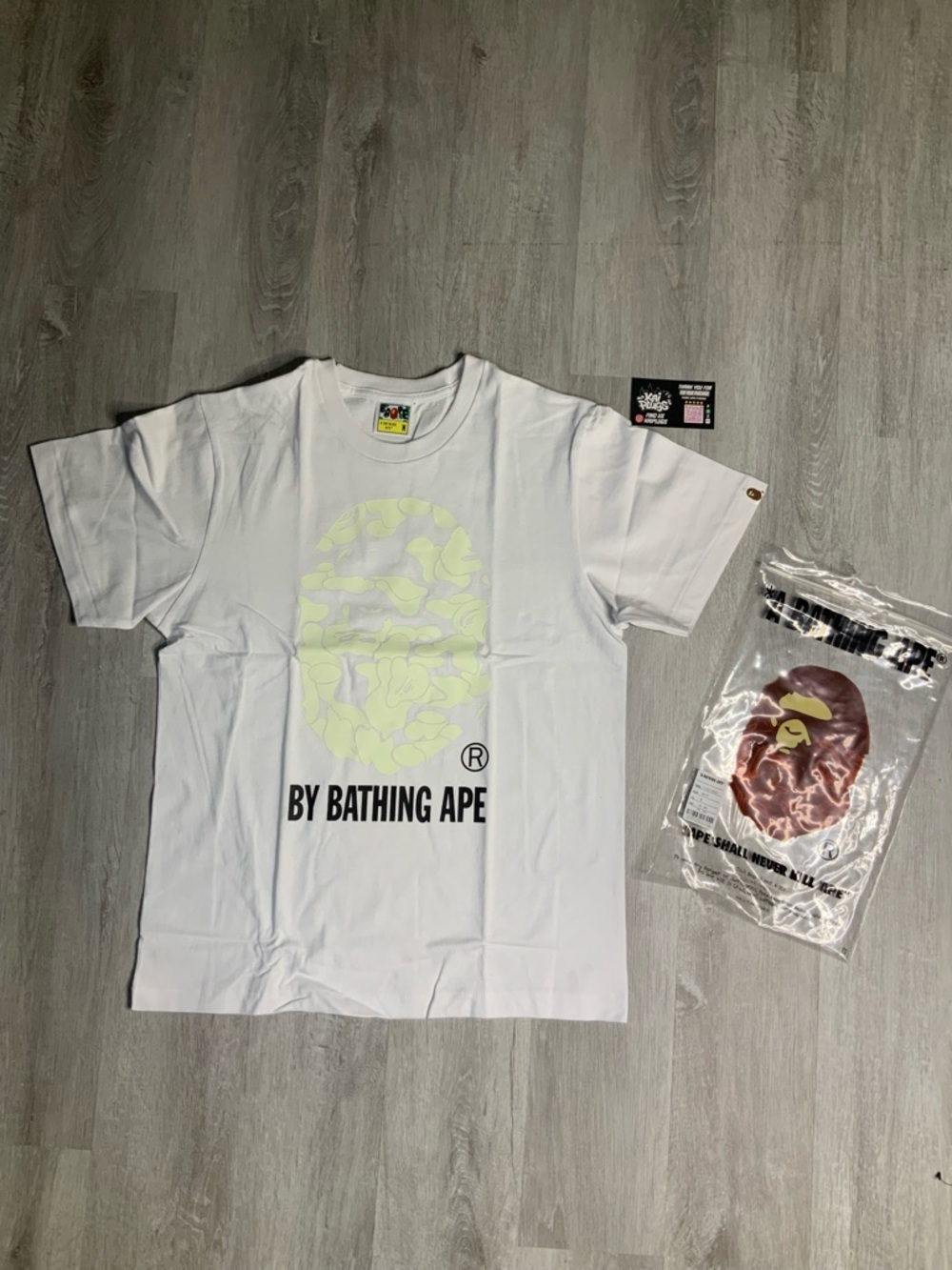 A Bathing Ape White Logo Tee with Pale Yellow Ape Print